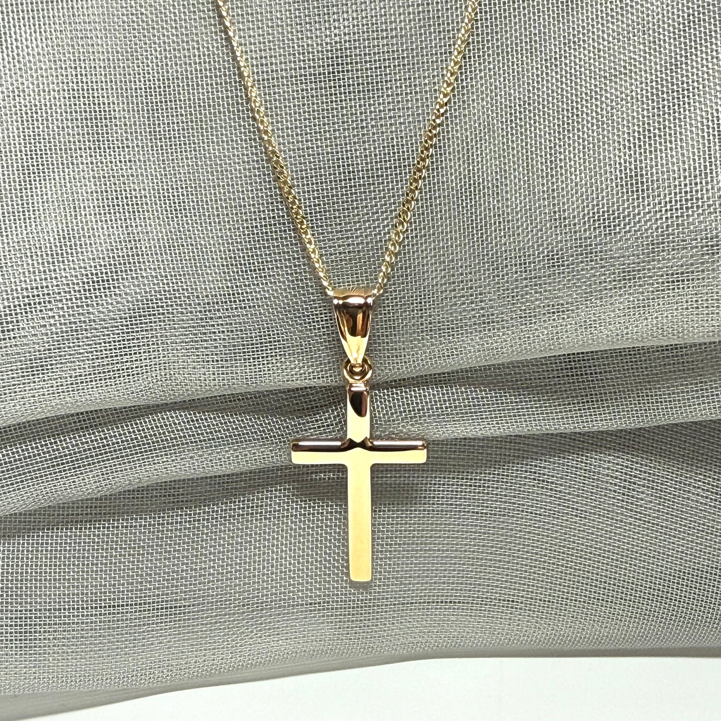 Polished plain polished yellow cross pendant
