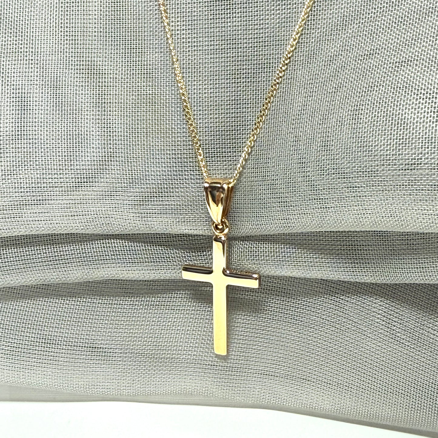 Polished plain polished yellow cross pendant