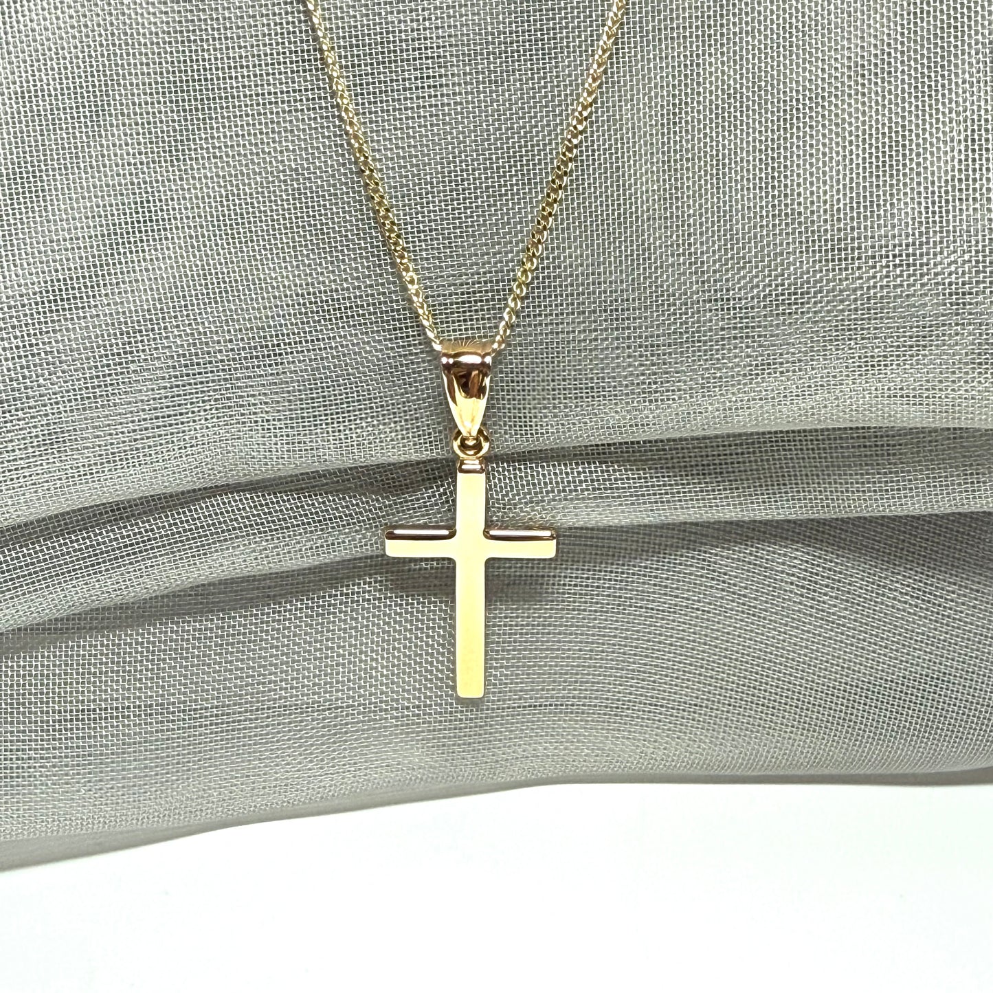 Polished plain polished yellow cross pendant