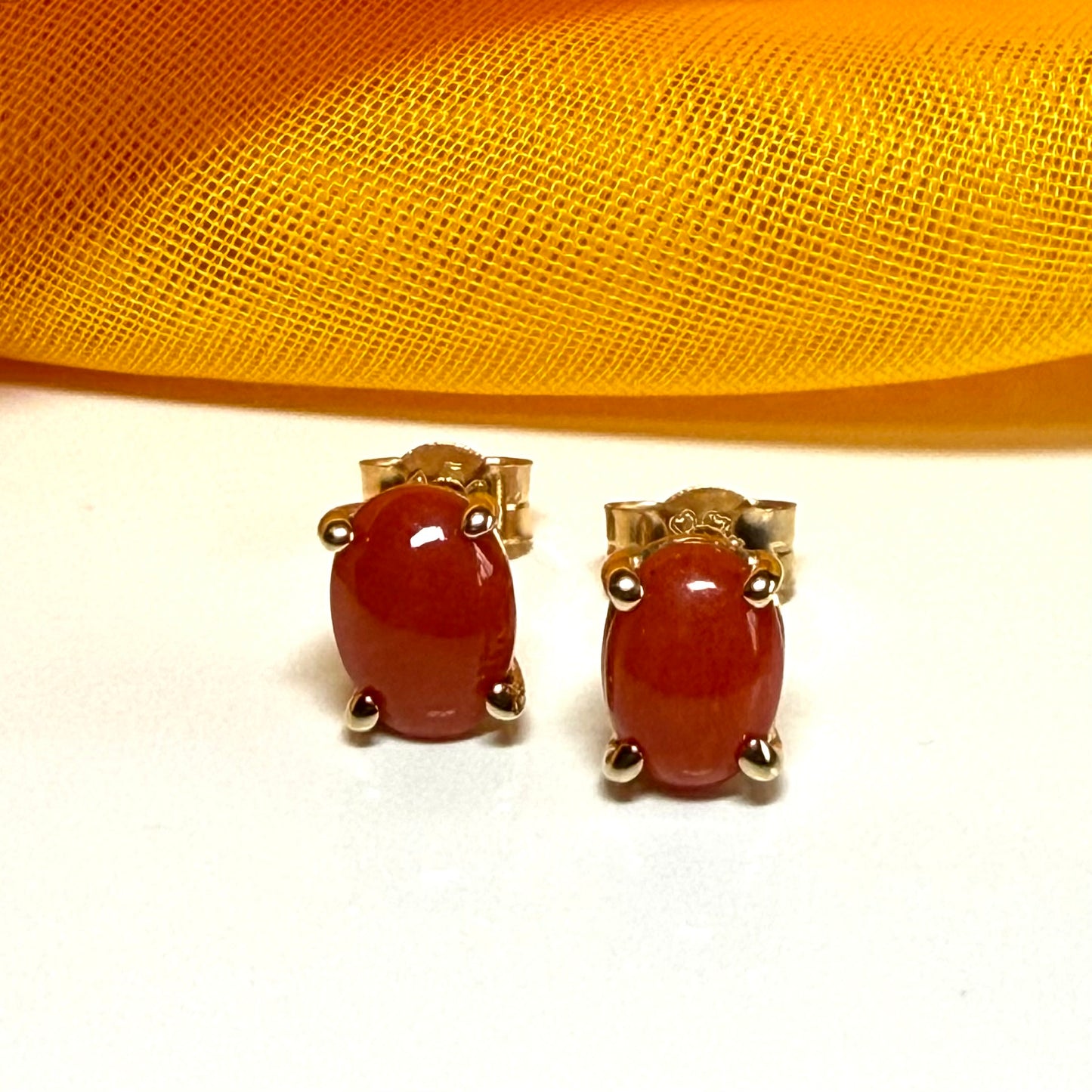 Real coral oval shaped stud earrings yellow gold