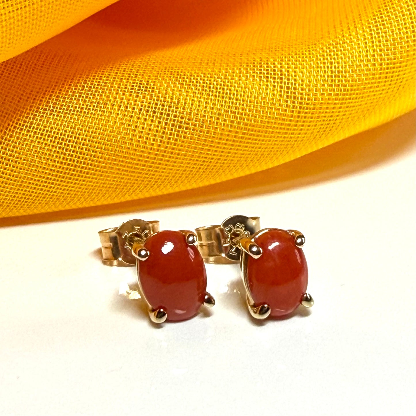 Real coral oval shaped stud earrings yellow gold