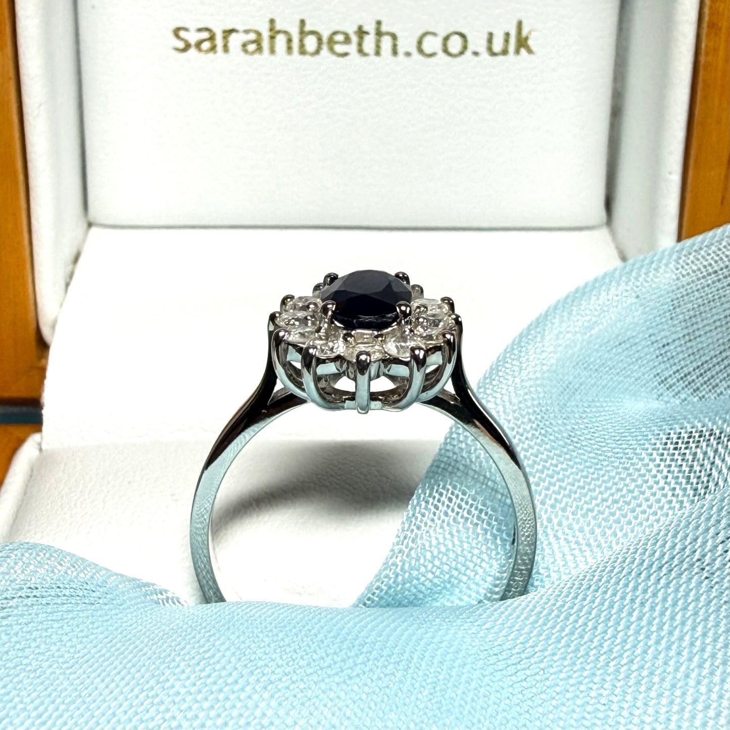 White gold real blue sapphire and diamond oval shaped cluster ring
