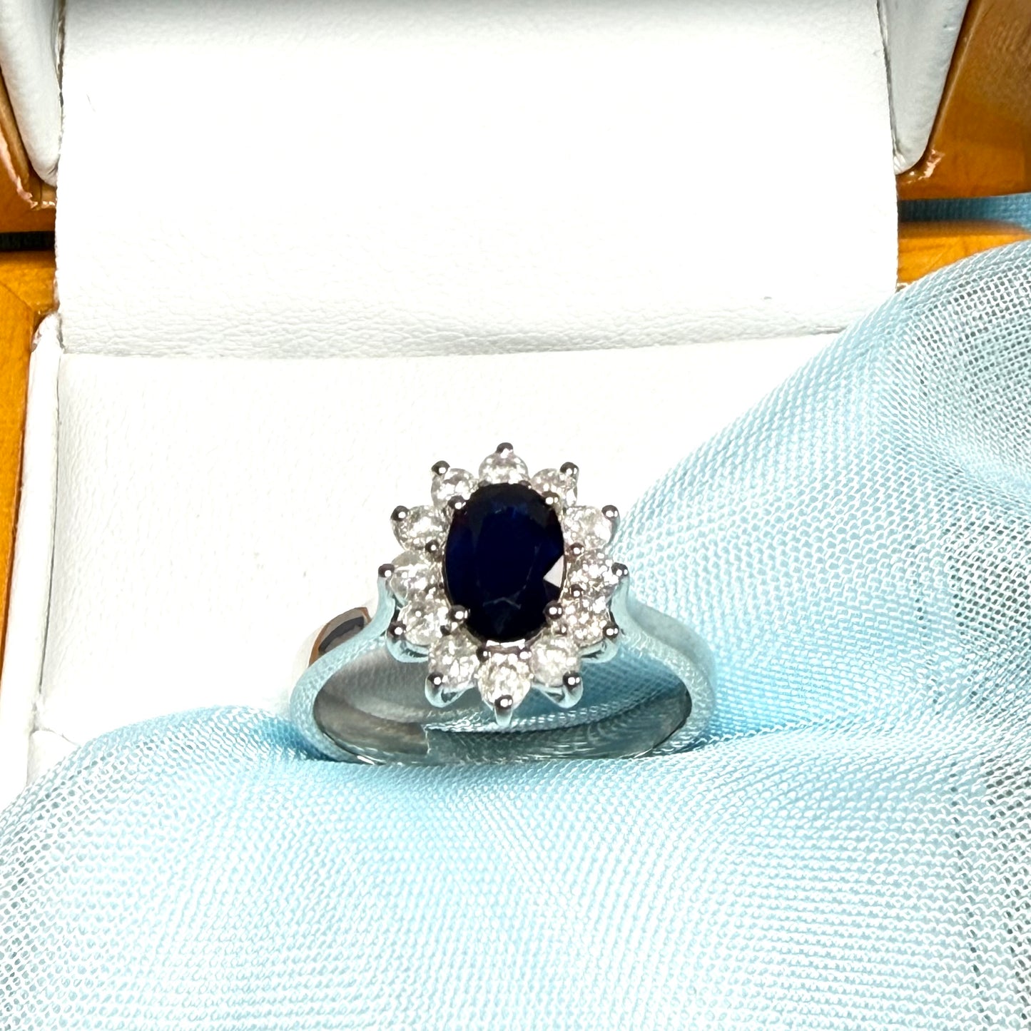 White gold real blue sapphire and diamond oval shaped cluster ring