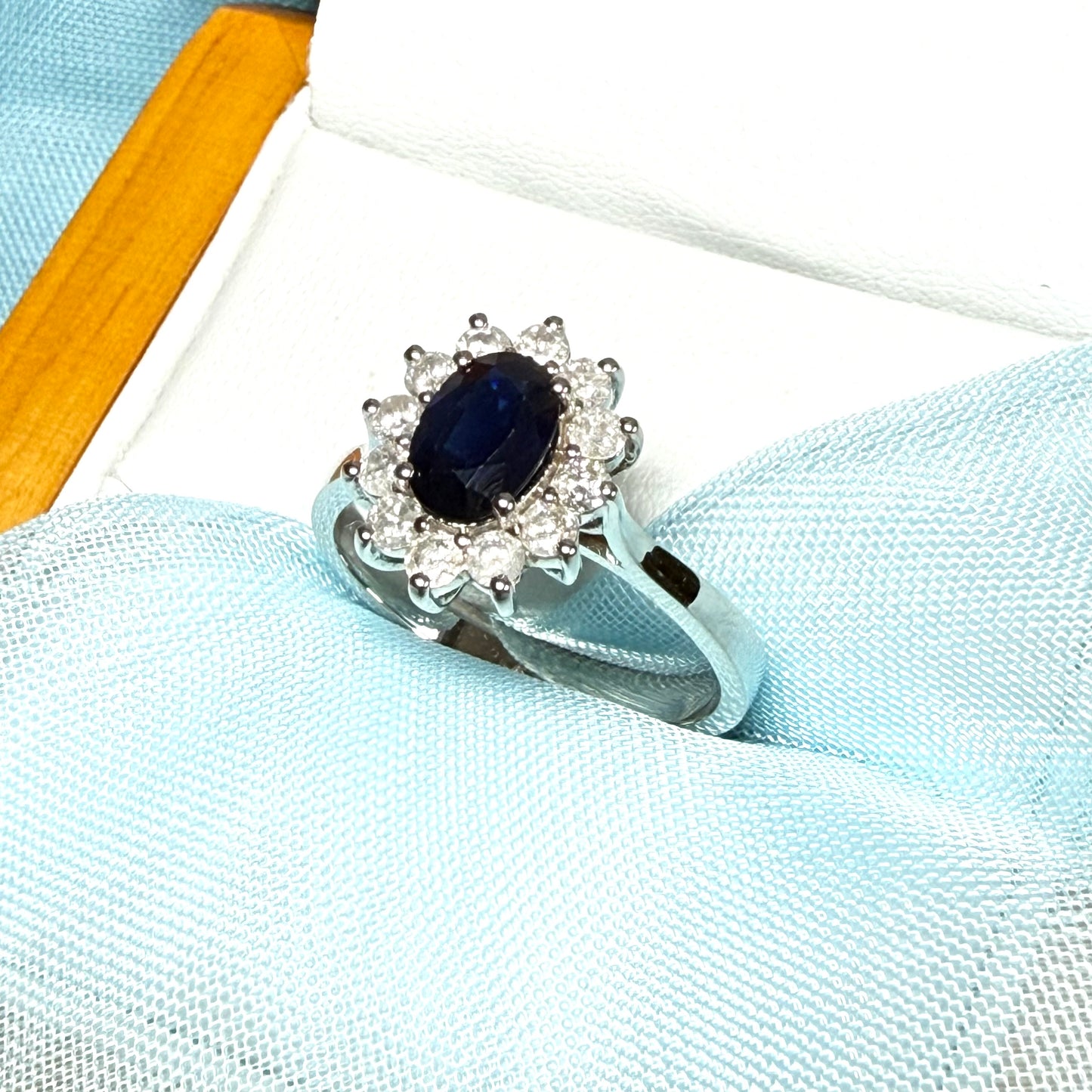 White gold real blue sapphire and diamond oval shaped cluster ring