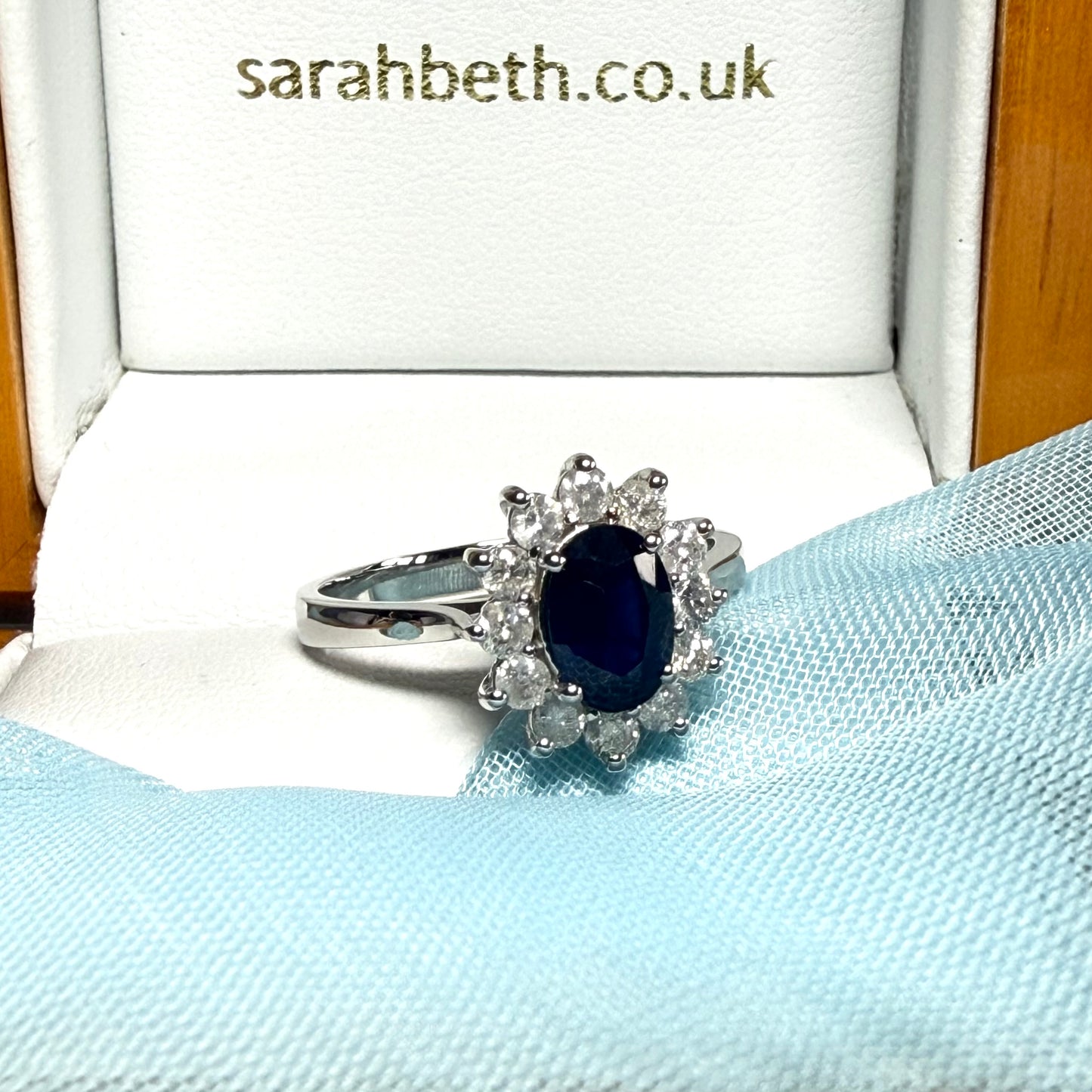 White gold real blue sapphire and diamond oval shaped cluster ring