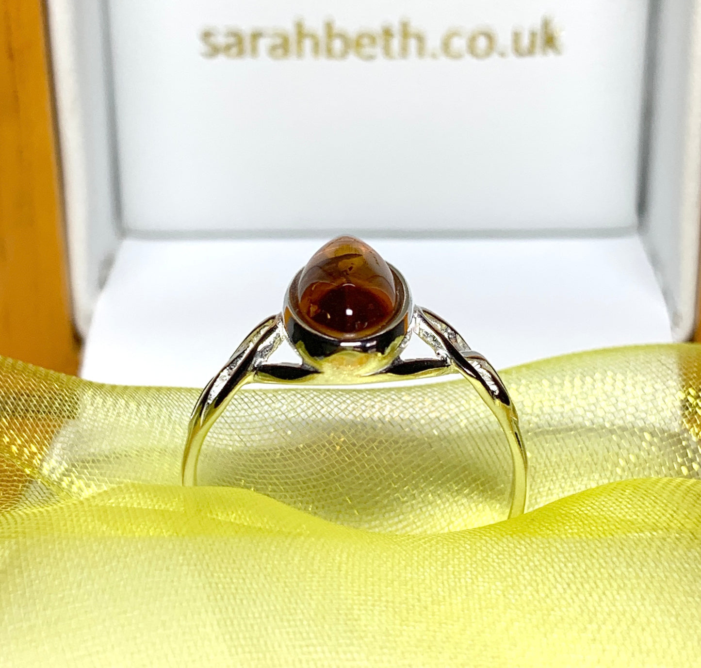 Real amber ring oval shaped Celtic designed shoulders