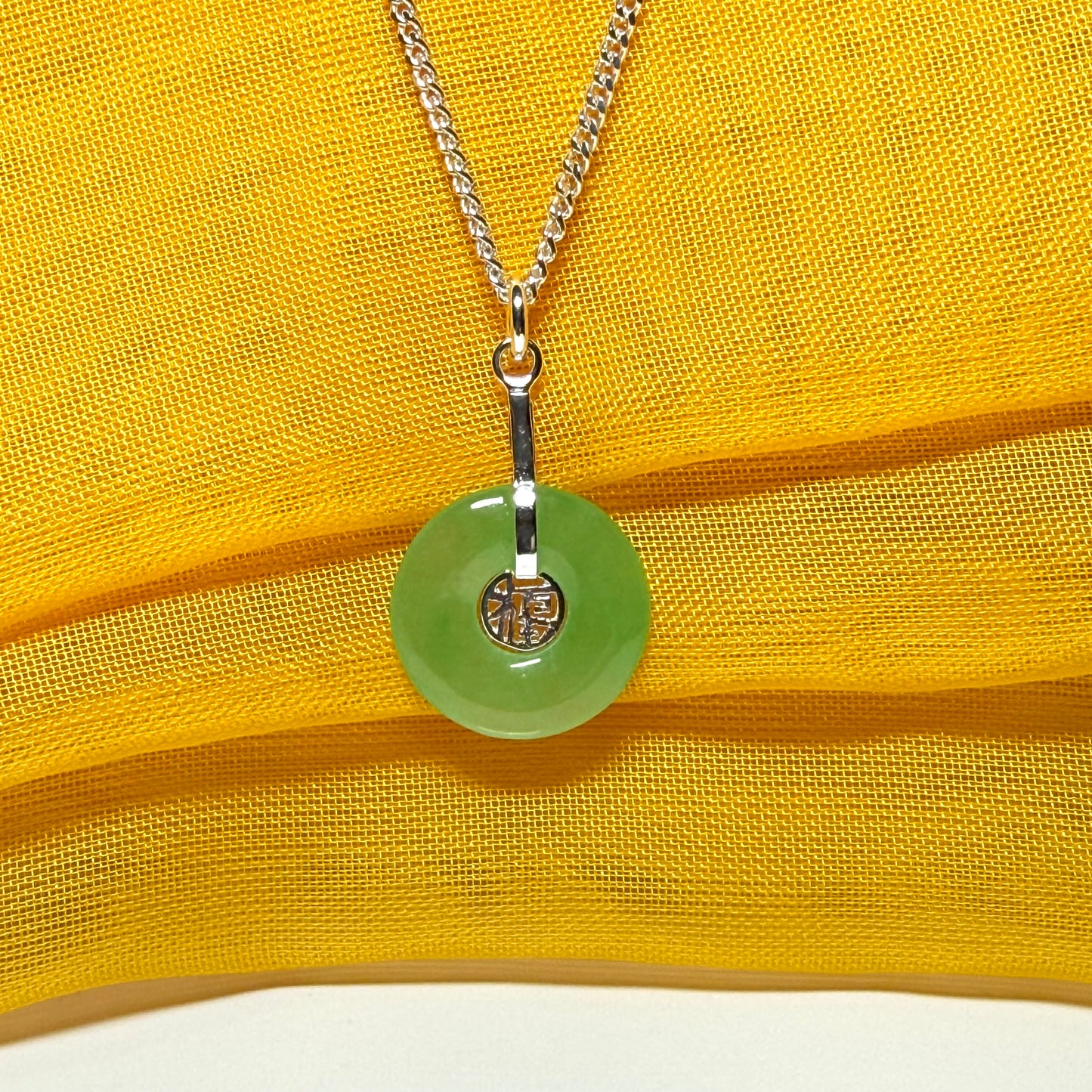 Real green jade necklace with a round pendant sterling silver and a chain included