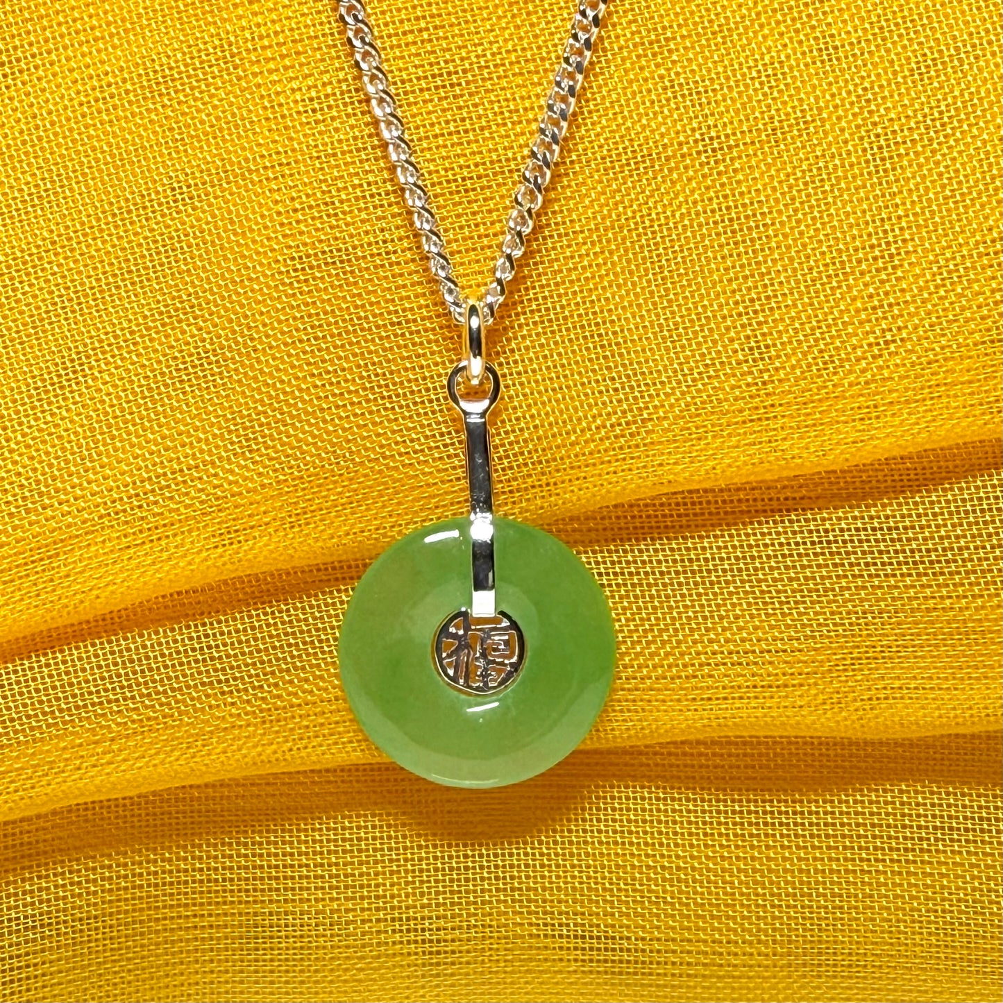 Real green jade necklace with a round pendant sterling silver and a chain included
