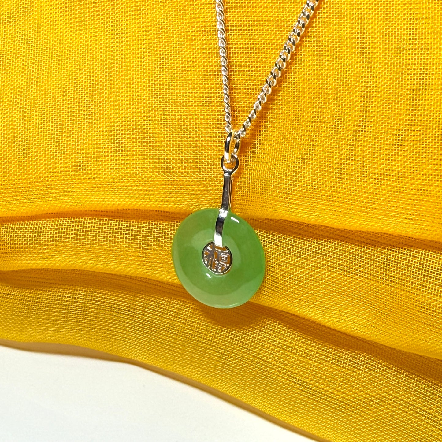 Real green jade necklace with a round pendant sterling silver and a chain included