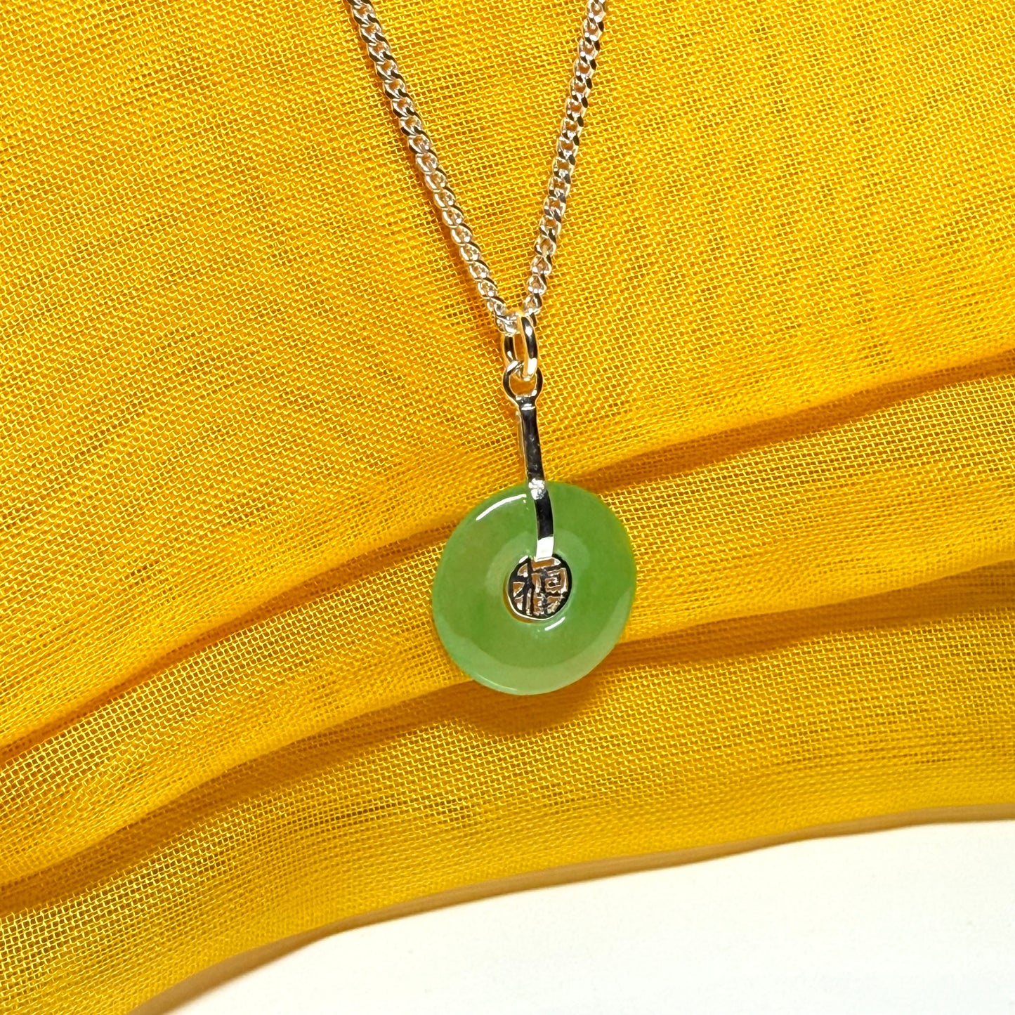 Real green jade necklace with a round pendant sterling silver and a chain included