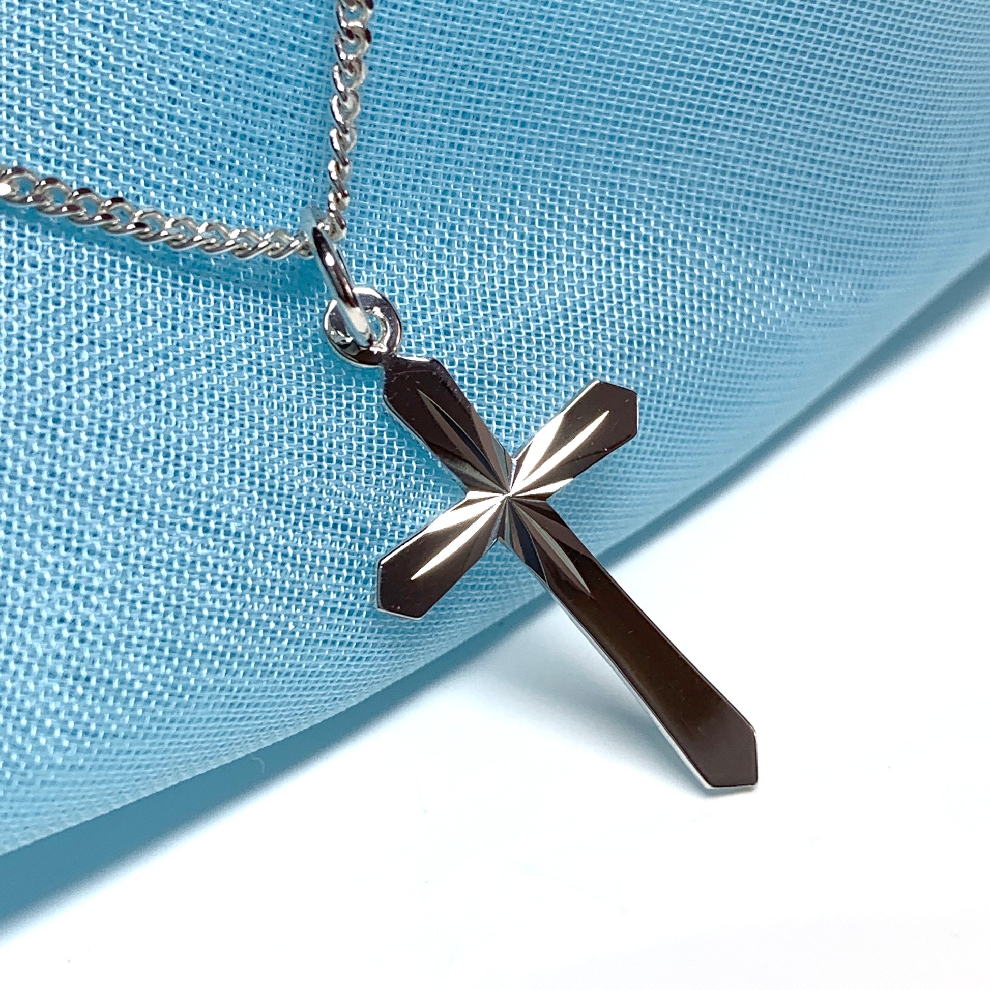 Small sterling silver diamond cut cross necklace including chain