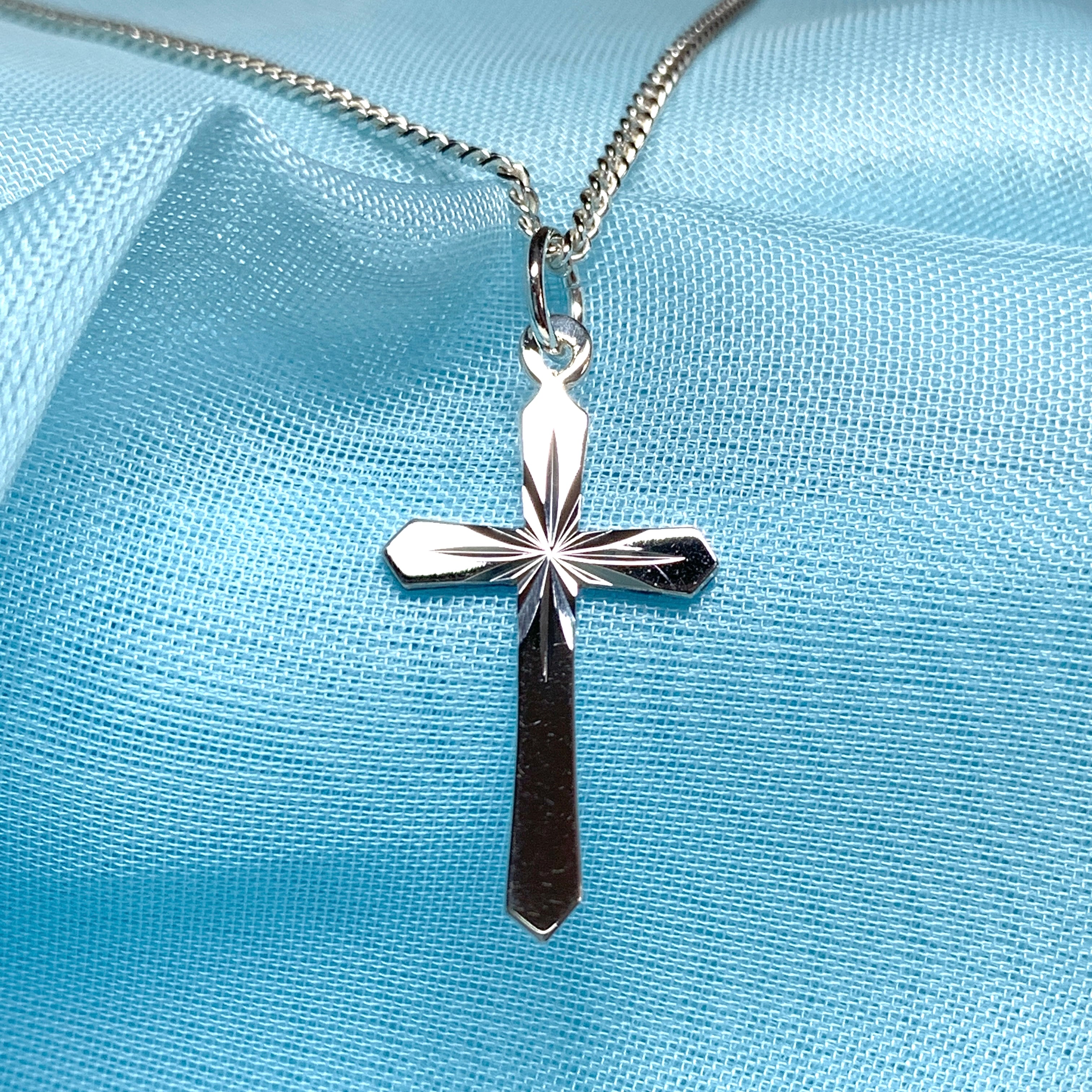 Small sterling silver diamond cut cross necklace including chain