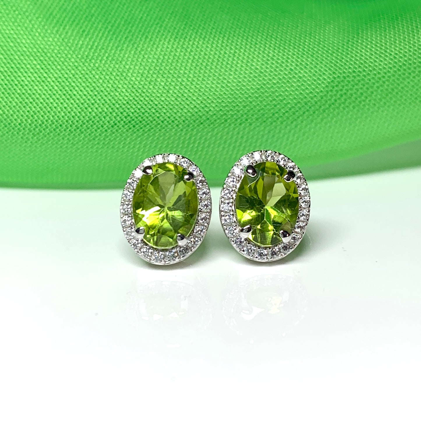 Real peridot and diamond stud earrings oval sterling silver