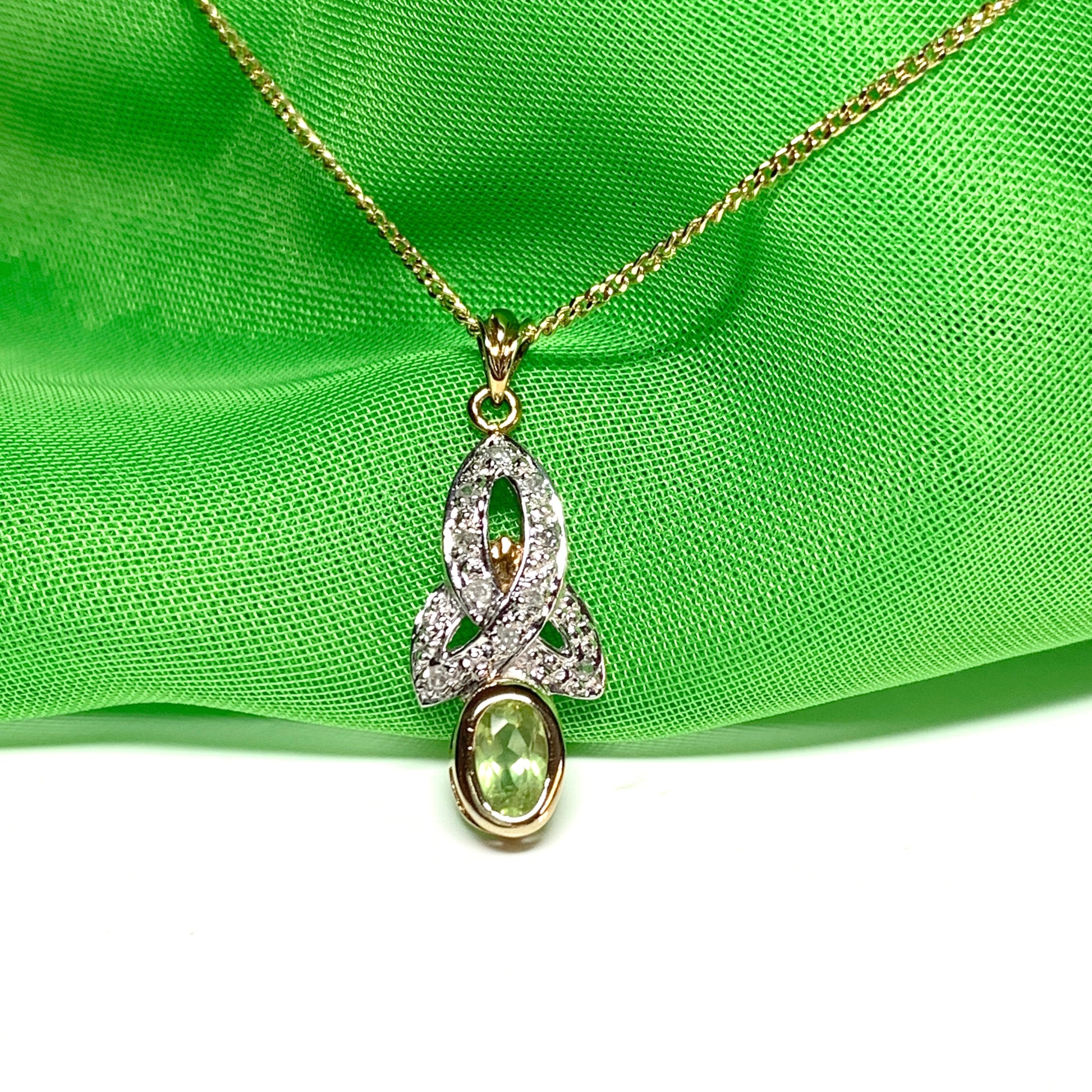 Peridot and diamond oval yellow gold necklace