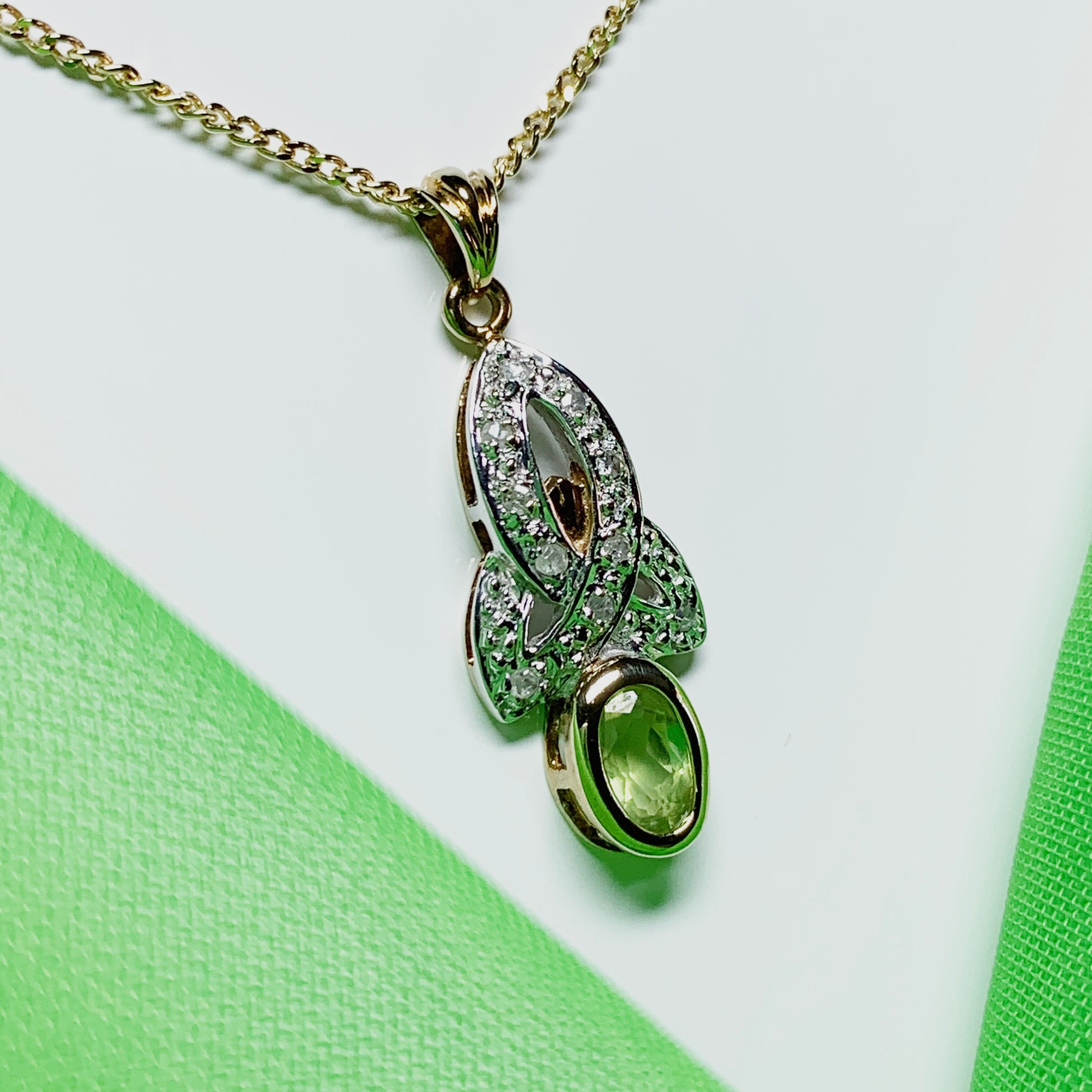 Peridot and diamond oval yellow gold necklace