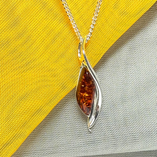 A real amber necklace sterling silver twisted marquise shaped amber pendant
