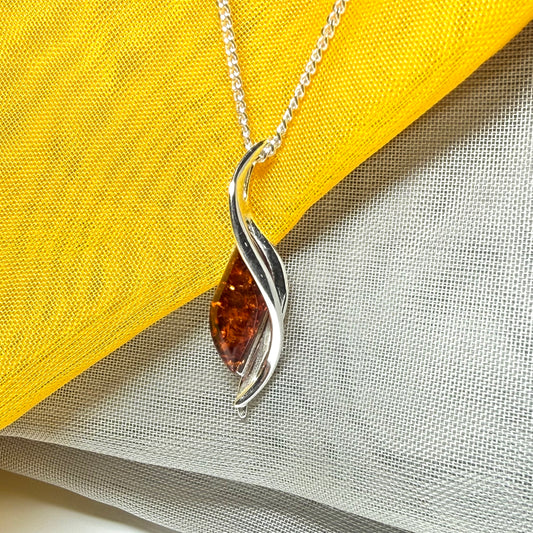 A real amber necklace sterling silver twisted marquise shaped amber pendant