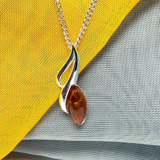 A sterling silver real amber marquise shape necklace open pierced pendant with a chain