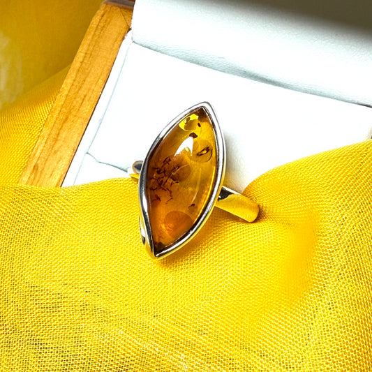 Large sterling silver real amber ring marquise shaped with a swirl