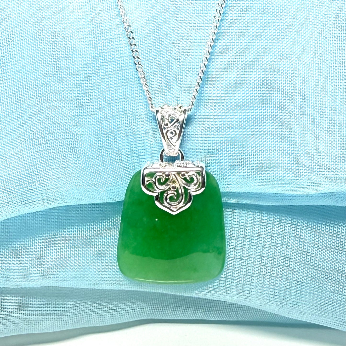 A stunning real jade necklace green sterling silver large cushion shaped, being a really gorgeous design