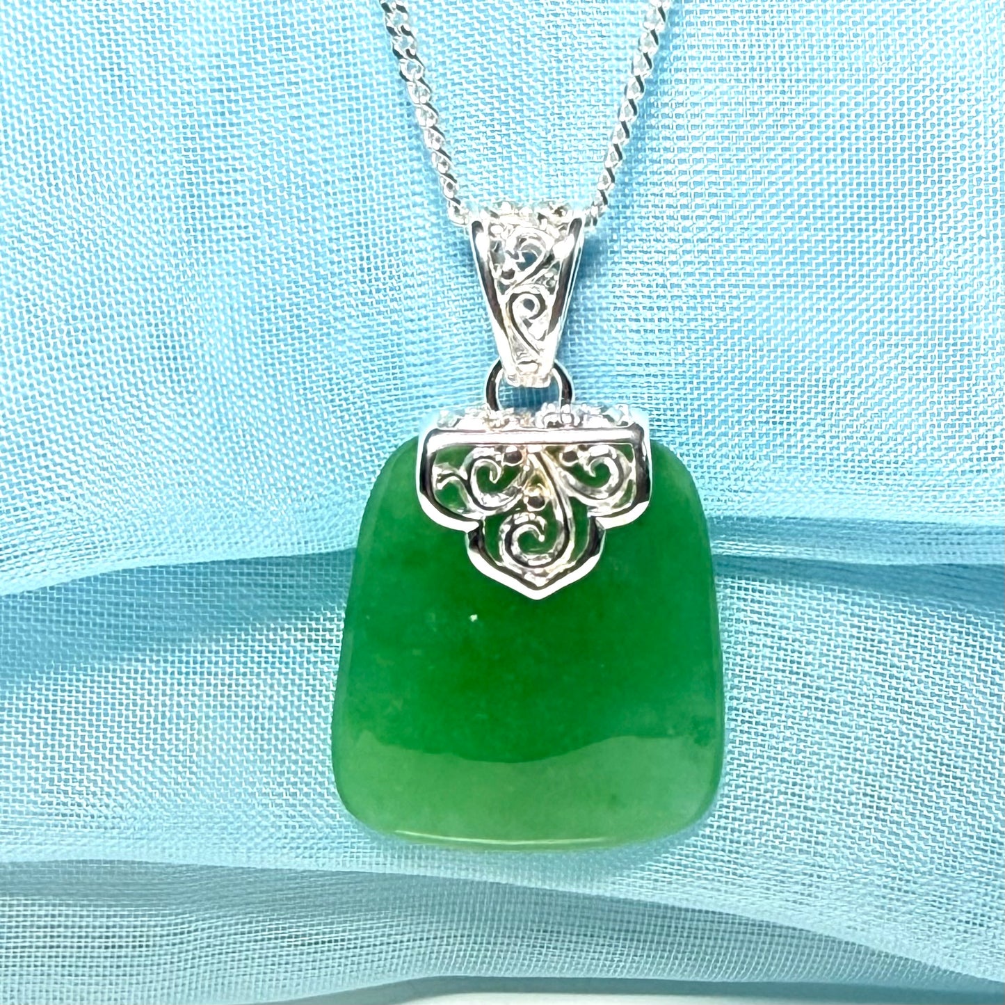 A stunning real jade necklace green sterling silver large cushion shaped, being a really gorgeous design