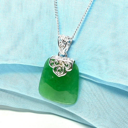 A stunning real jade necklace green sterling silver large cushion shaped, being a really gorgeous design