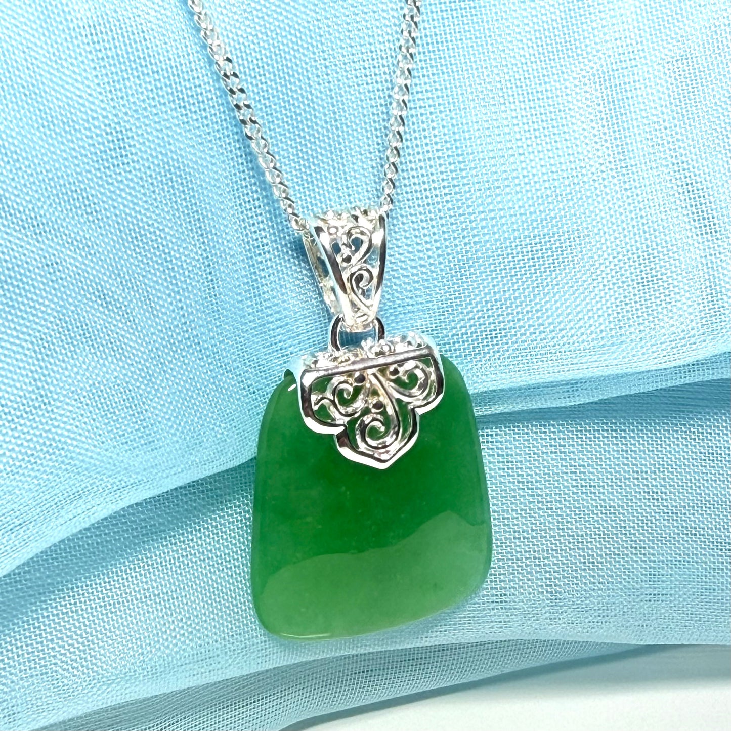 A stunning real jade necklace green sterling silver large cushion shaped, being a really gorgeous design