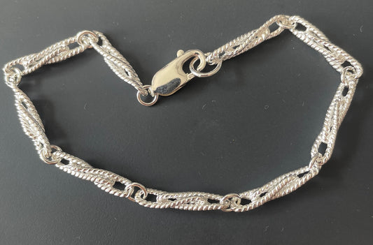 Ladies sterling silver bracelet twisted fancy patterned solid link