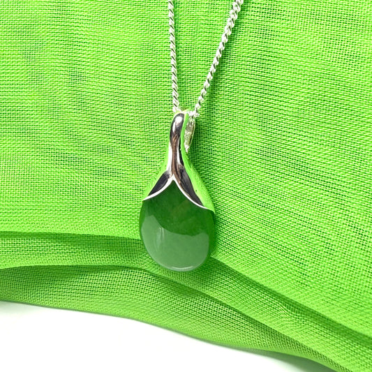 A real green jade pendant teardrop with a pear shaped necklace, with chain included