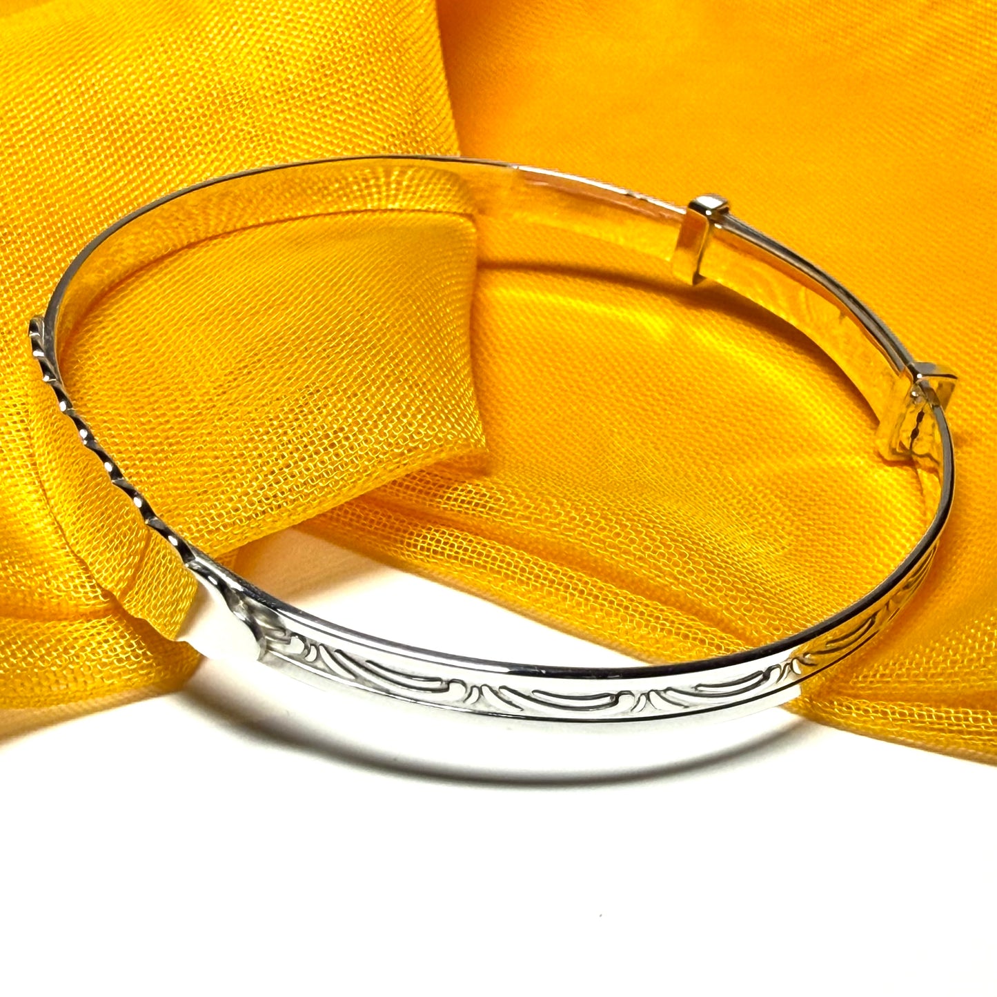 Childs expanding bangle swirl patterned identity designed sterling silver