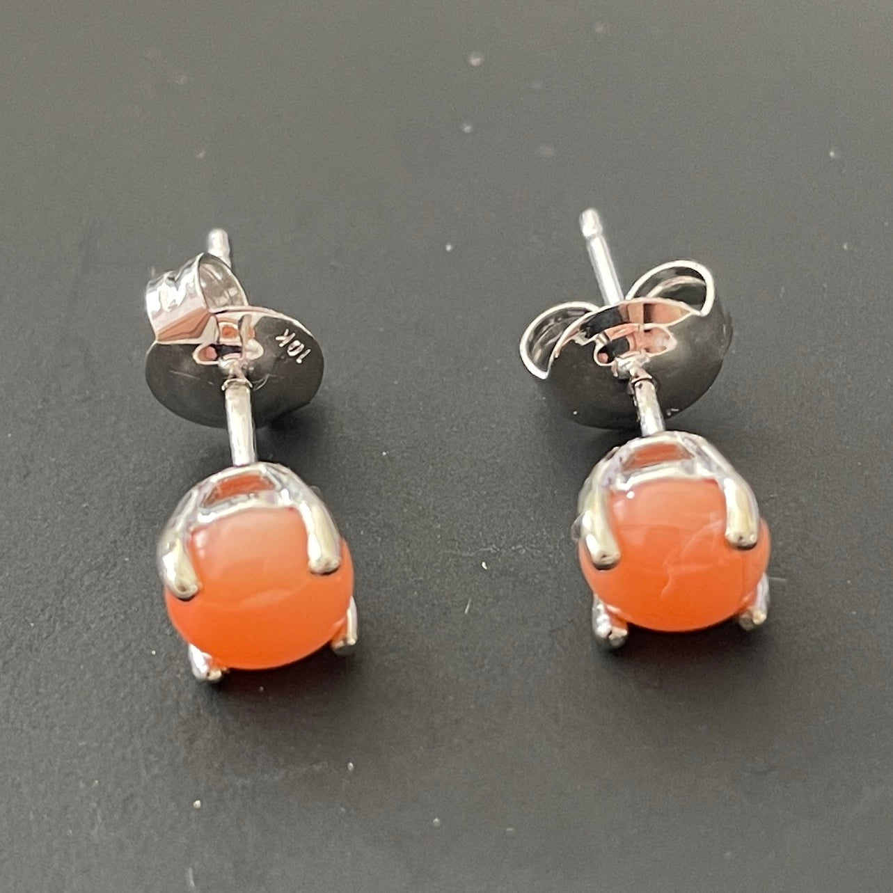 Real coral white gold round claw set stud earrings