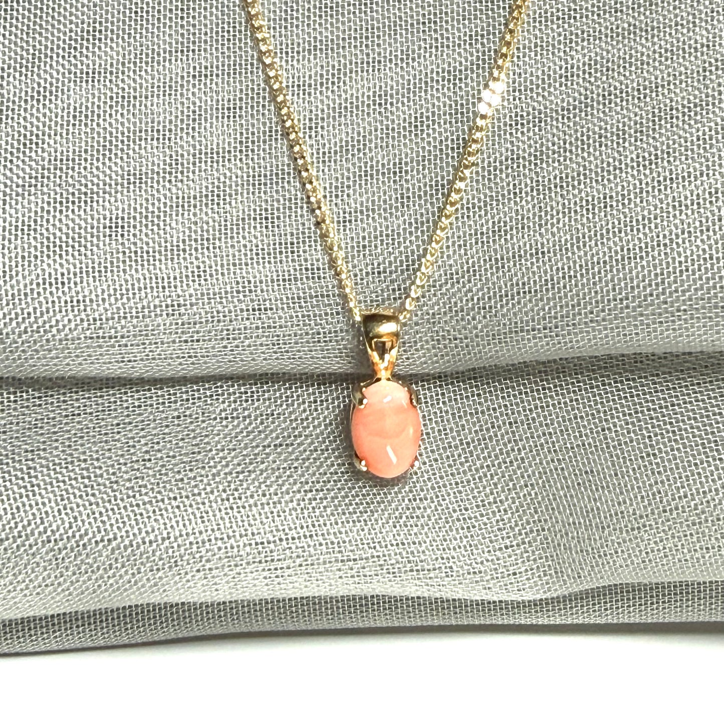 Oval shaped real coral yellow gold necklace pendant with a pierced setting