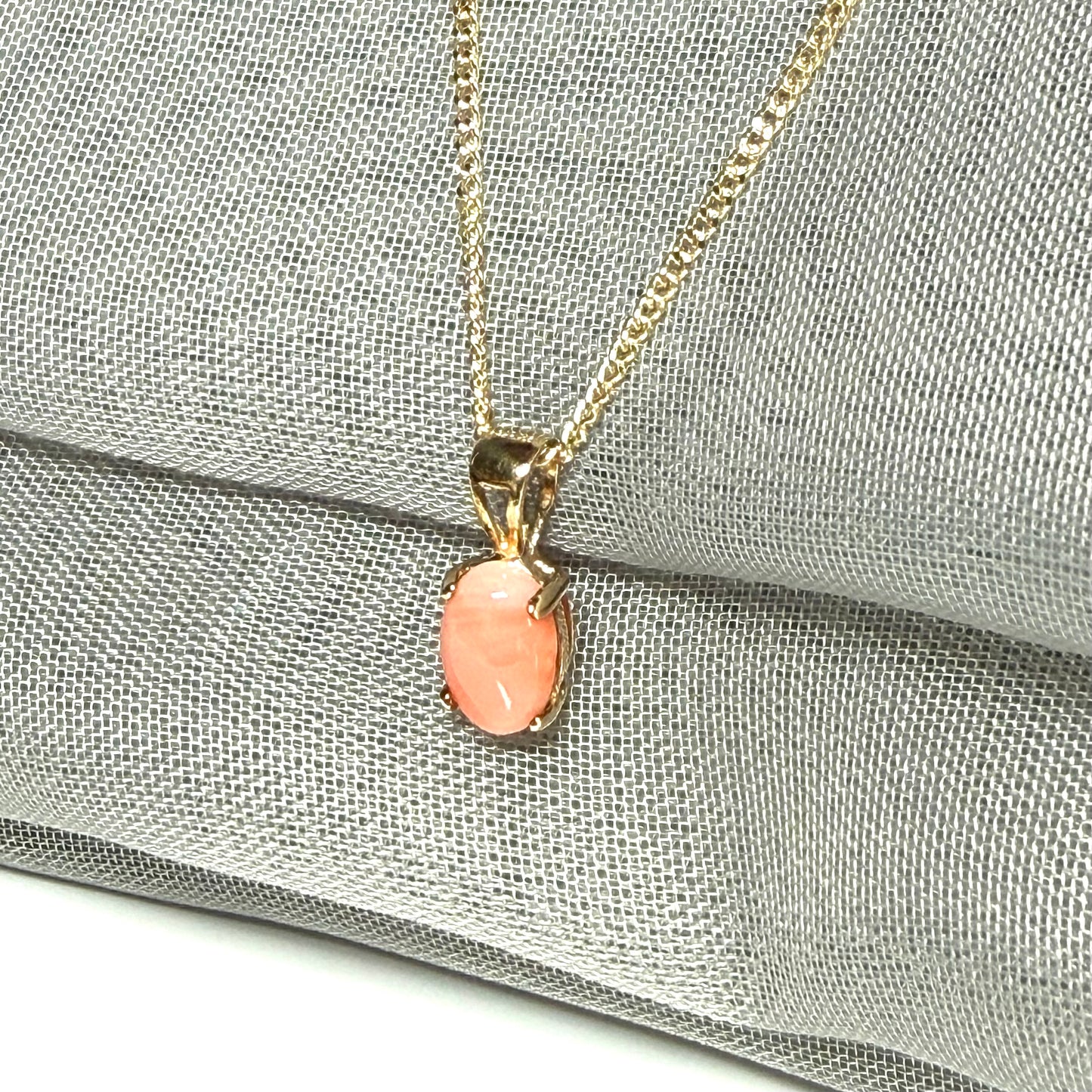 Oval shaped real coral yellow gold necklace pendant with a pierced setting