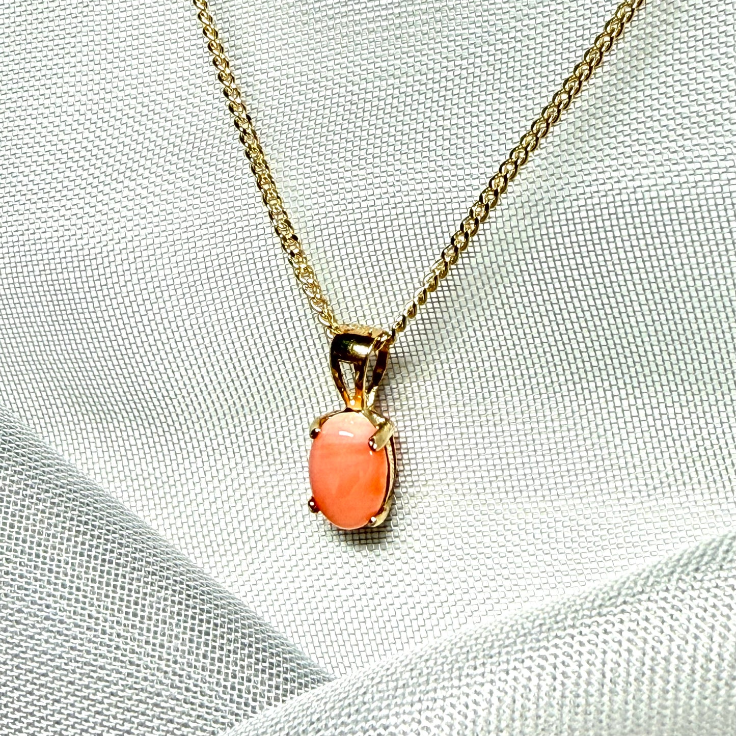 Oval shaped real coral yellow gold necklace pendant with a pierced setting