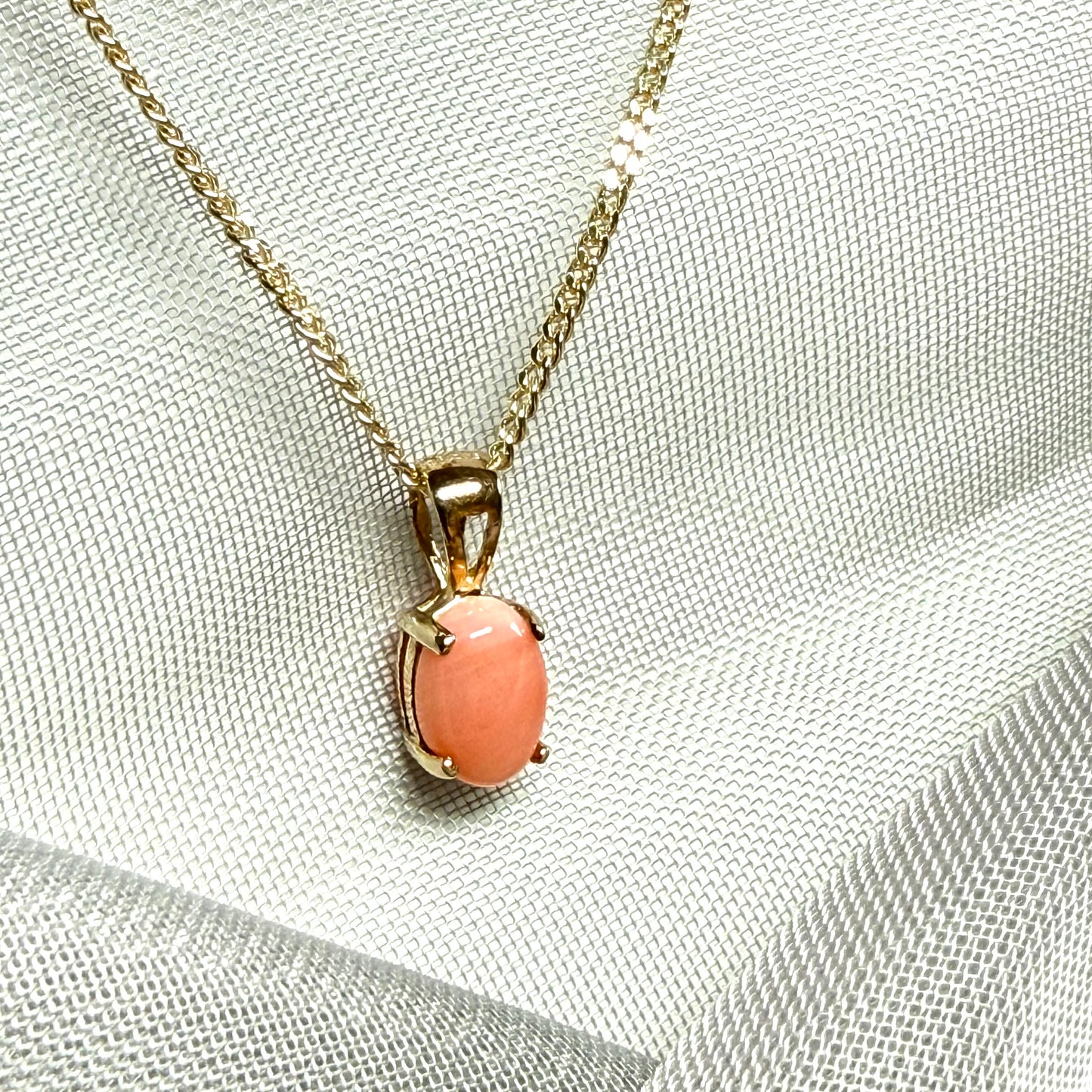 Oval shaped real coral yellow gold necklace pendant with a pierced setting