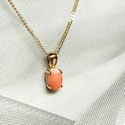 Oval shaped real coral yellow gold necklace pendant with a pierced setting