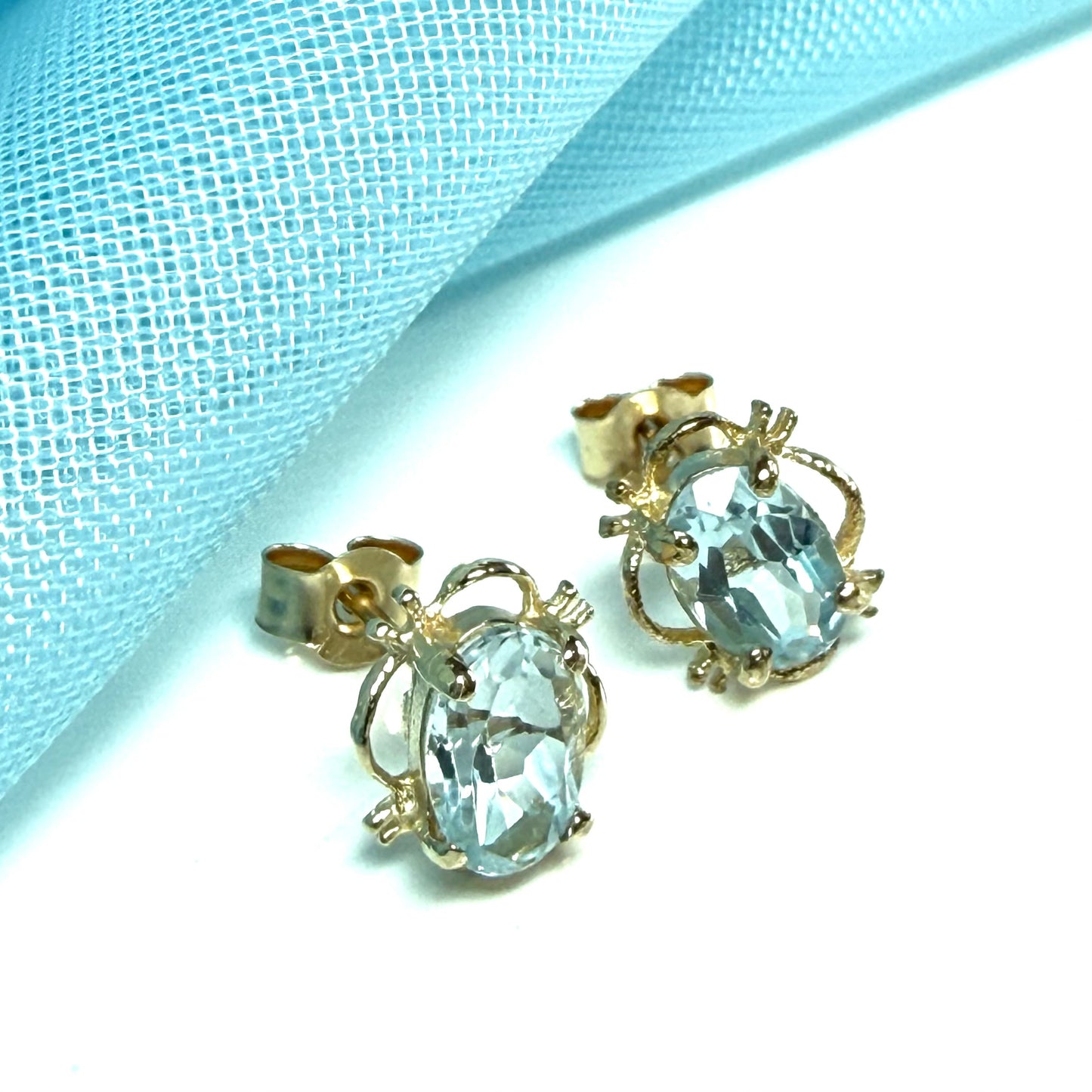 Yellow Gold Light Blue Topaz Stud Earrings Oval Shape
