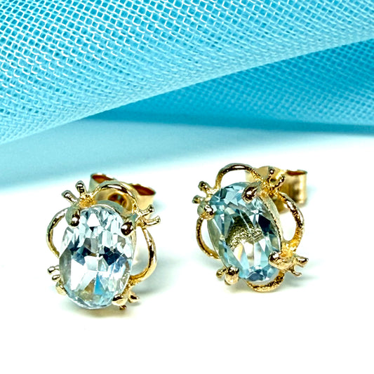 Yellow Gold Light Blue Topaz Stud Earrings Oval Shape