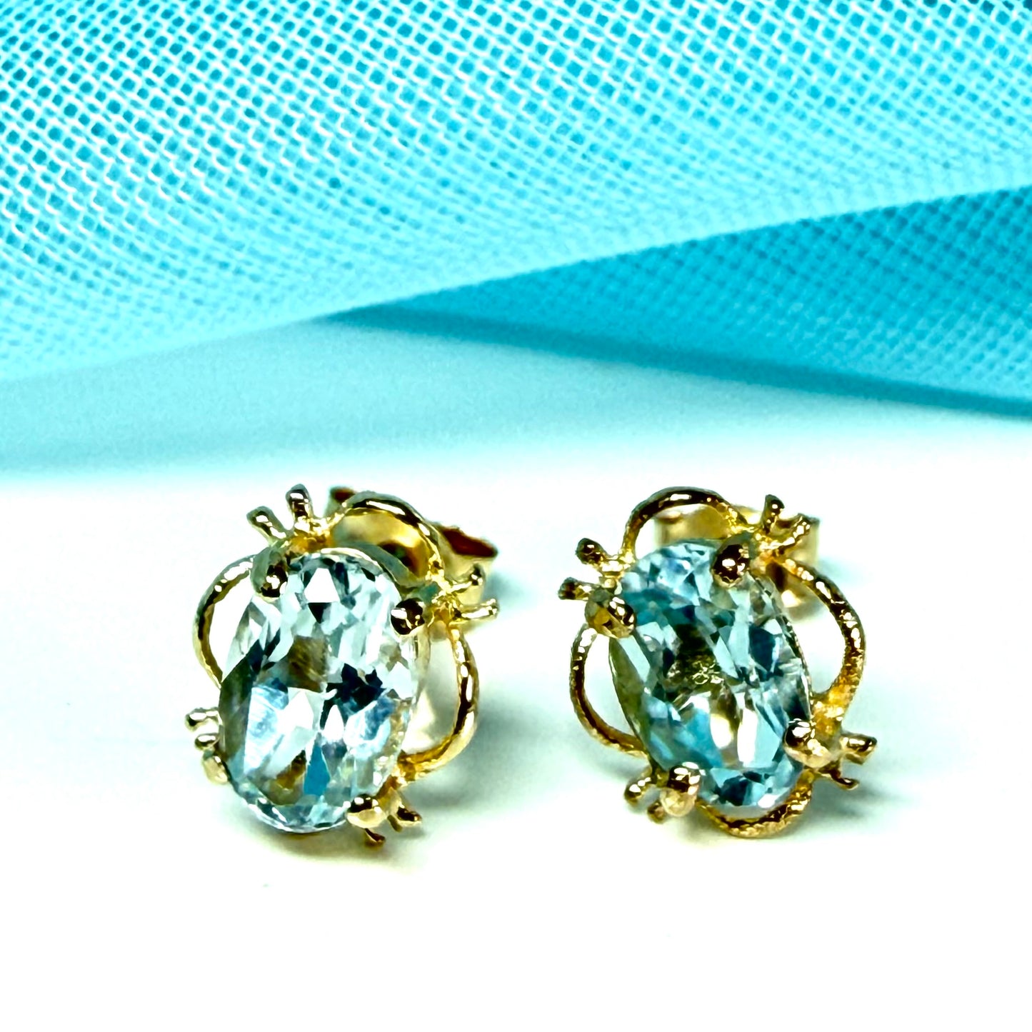 Yellow Gold Light Blue Topaz Stud Earrings Oval Shape