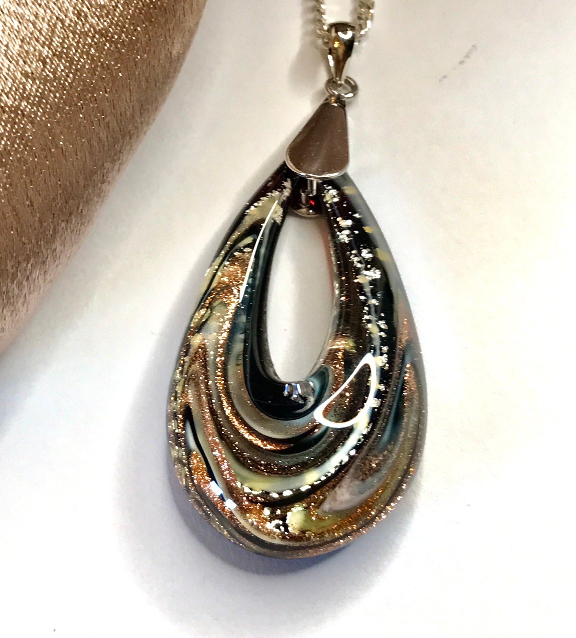 Real Murano glass necklace silver and gold pendant on a white background