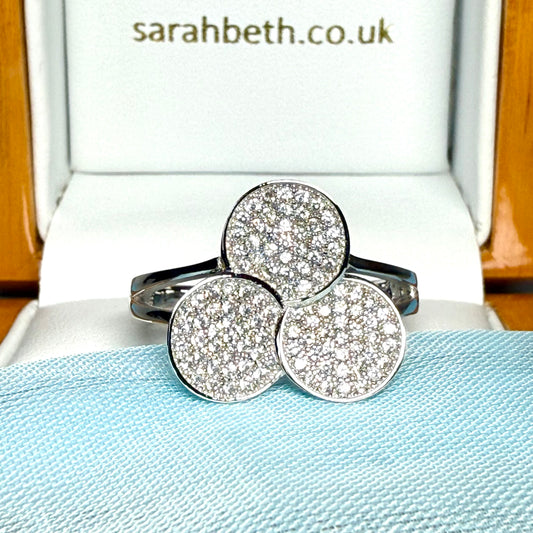 Ladies sterling silver cluster ring with a triple round shaped fancy design