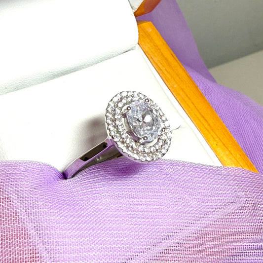 Ladies sterling silver oval shaped halo cluster ring