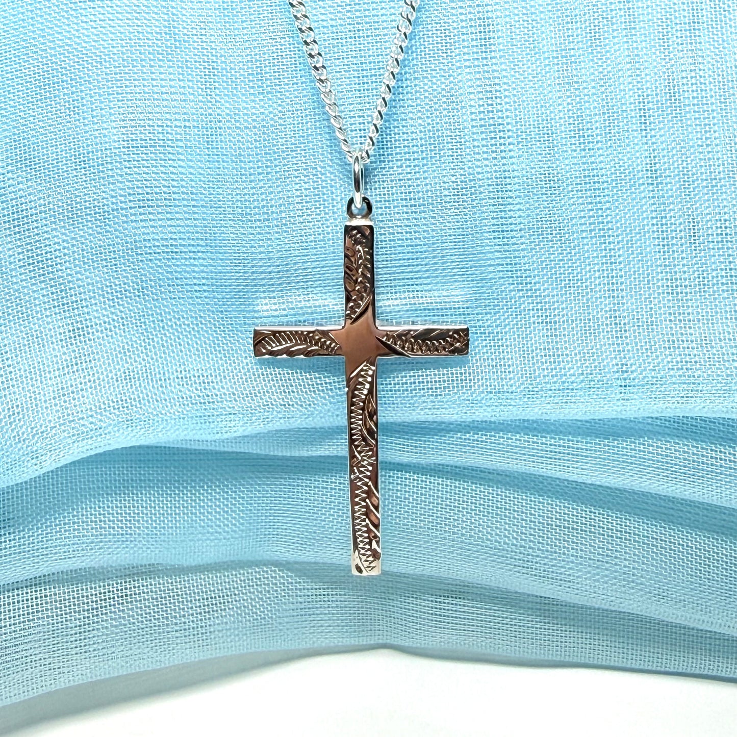 Large cross sterling silver with a patterned design