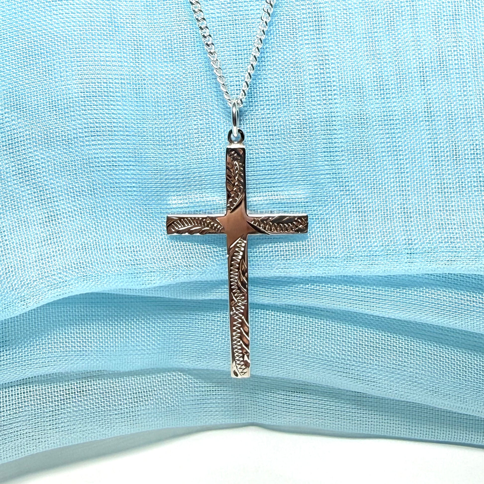 Large cross sterling silver with a patterned design