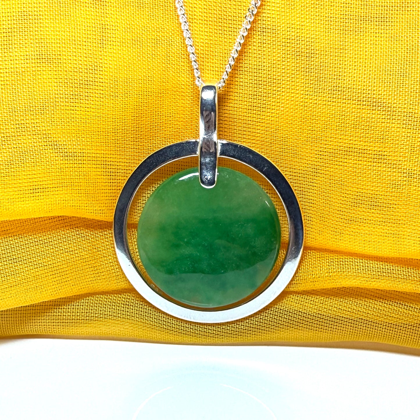 Large silver round shaped green real jade necklace pendant with a chain