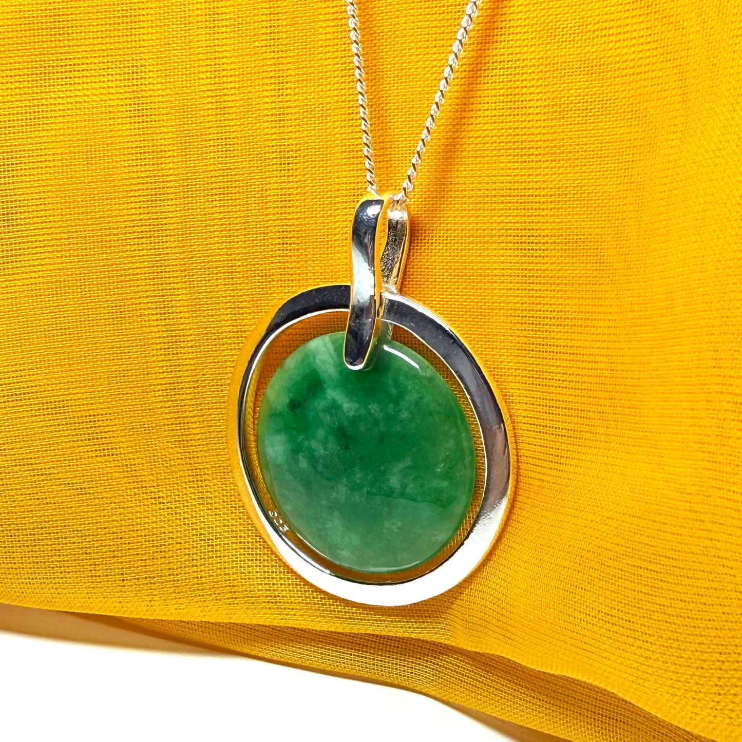 Large silver round shaped dark green real jade pendant necklace with a chain