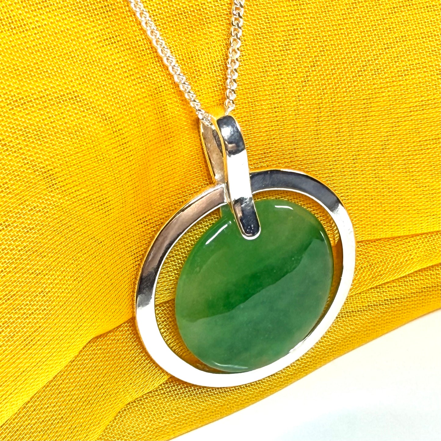 Large silver round shaped green real jade necklace pendant with a chain