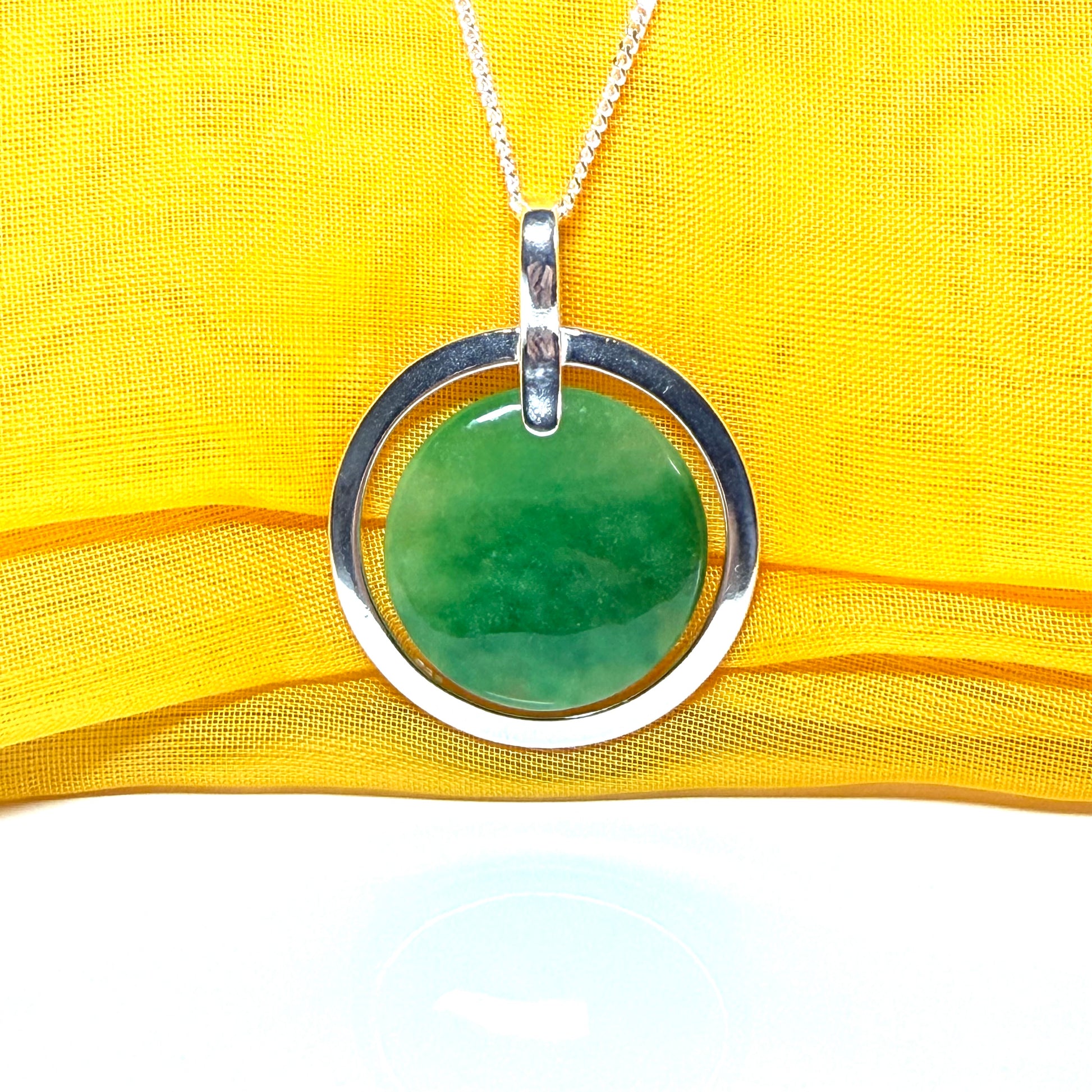 Large silver round shaped green real jade necklace pendant with a chain