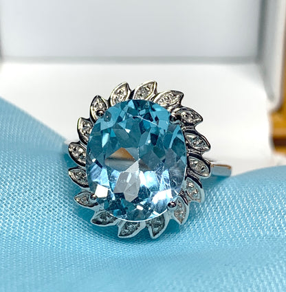 Large oval blue topaz and diamond sterling silver cluster ring