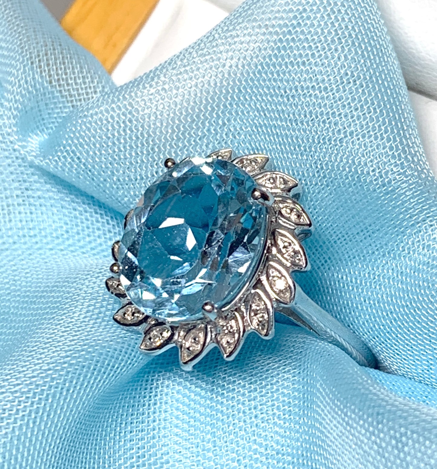 Large oval blue topaz and diamond sterling silver cluster ring